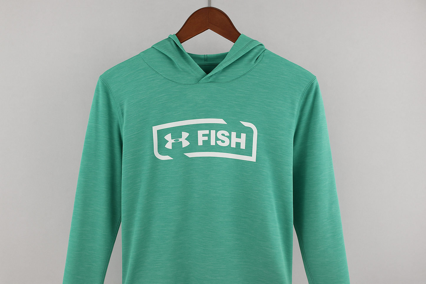 Hoodie Under Armour Fish verde menta - Colgada en percha