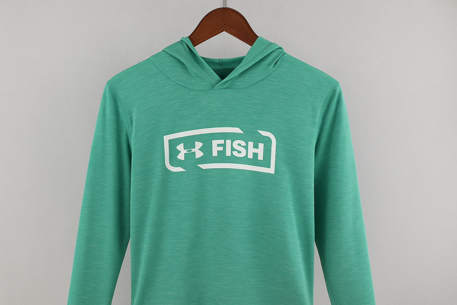 Hoodie Under Armour Fish verde menta - Colgada en percha