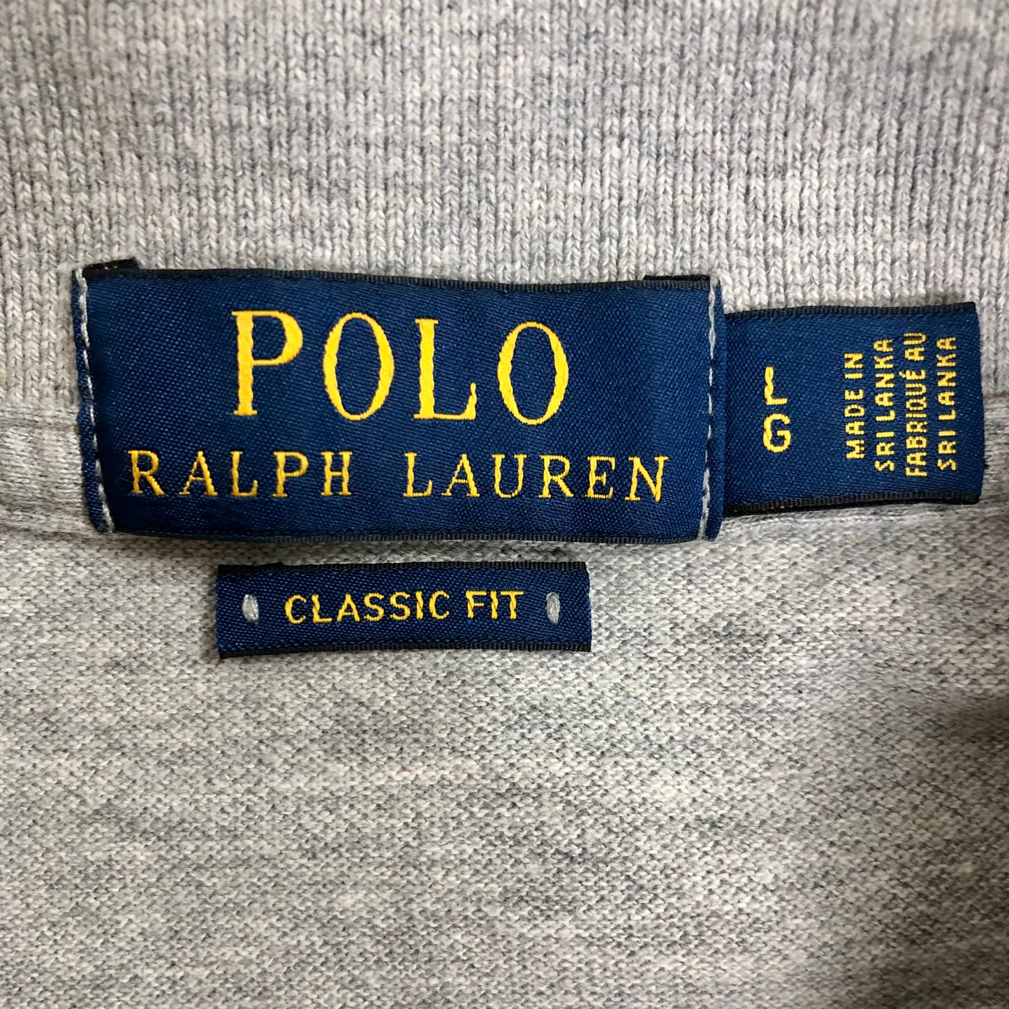 Camiseta Polo Ralph Lauren 🏇🏼 color gris con patrón de logo color azul navy Talla L Entalle Clásico