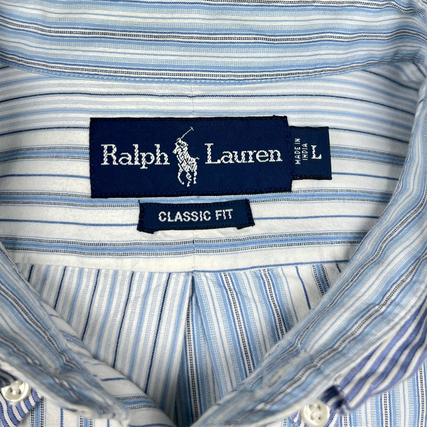 Camisa Polo Ralph Lauren 🏇🏼 color Blanco con patron de rayas en celeste y azul navy Talla L Entalle Clásico (ver descripción)