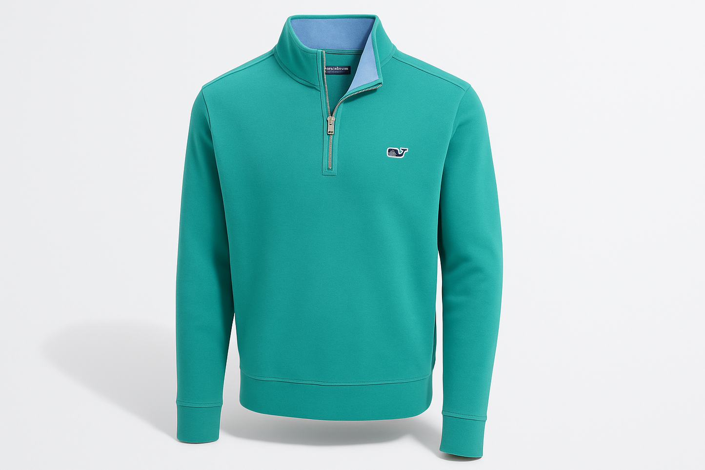 Vista en ángulo 3/4 del suéter Vineyard Vines color #06a19a con logo muy pequeño e interior celeste